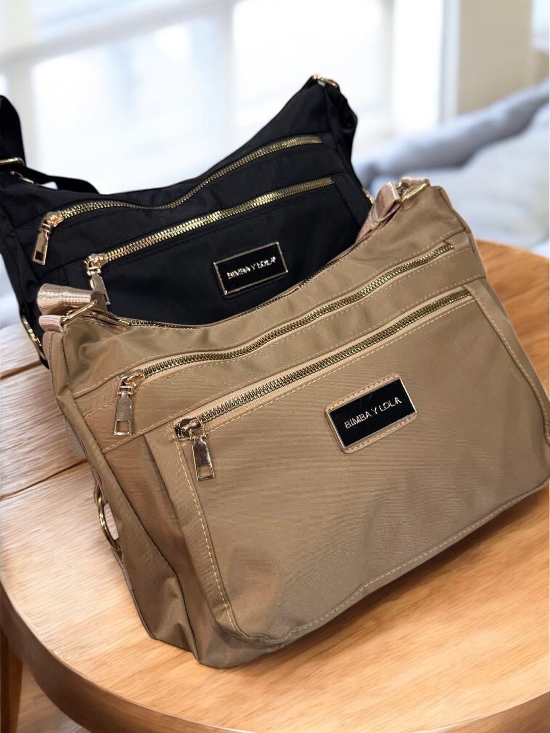 bolsos de varioas colores y marcas - Imagen 6